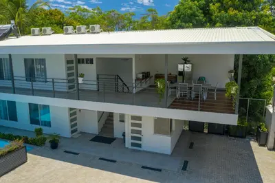 an aerial view of a house with a balcony at HOTEL MARINO BALLENA in Uvita