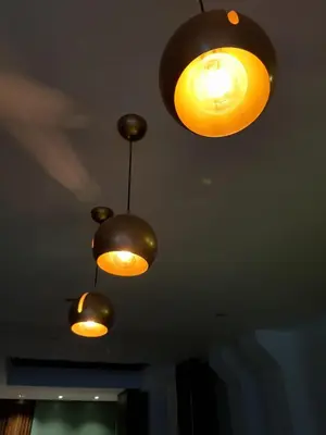 a group of lights hanging from a ceiling at Hotel Cultura Plaza in San José