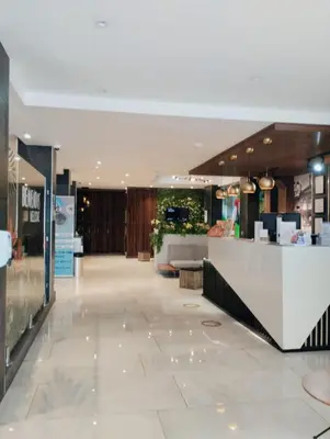 a lobby of a store with a counter in the middle at Hotel Cultura Plaza in San José