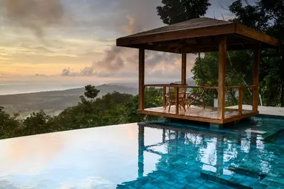 a swimming pool with a gazebo on top of it at Lapazul Boutique Hotel in Savegre