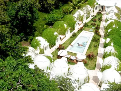 an overhead view of a garden with white domes at Igloo Beach Lodge in Manuel Antonio