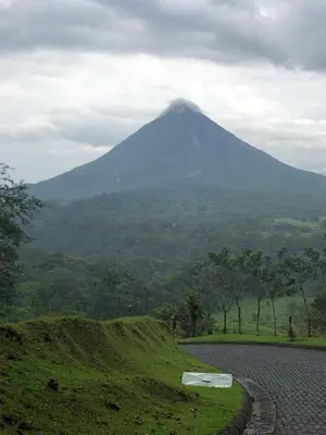 a mountain in the distance with a road in the foreground at Sangregado Lodge in Fortuna