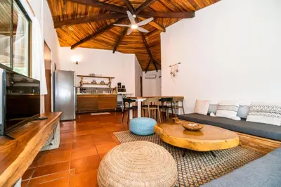 a living room with a couch and a table at SoulShine in Playa Avellana