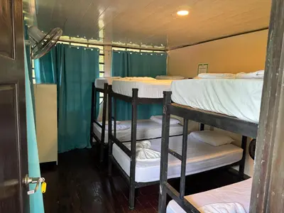 a group of bunk beds in a room at Yubarta Lodge in Uvita