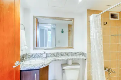 a bathroom with a sink and a mirror at Costa Linda 7-13 in Jacó