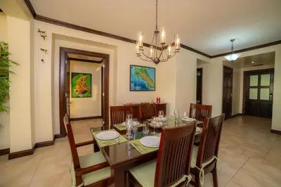 a dining room with a table and chairs at AltaVista 5A 3 bdr Ocean View in Los Suenos in Herradura