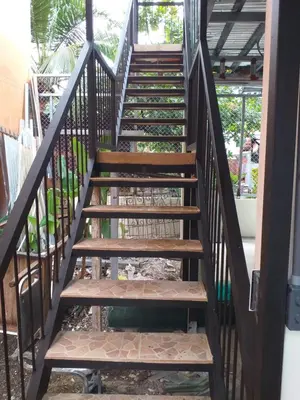 a set of stairs leading up to a house at Los Sueños RyG 3 in Quepos