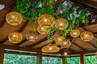 a bunch of lights hanging from a ceiling at Lost Iguana Resort and Spa in Fortuna