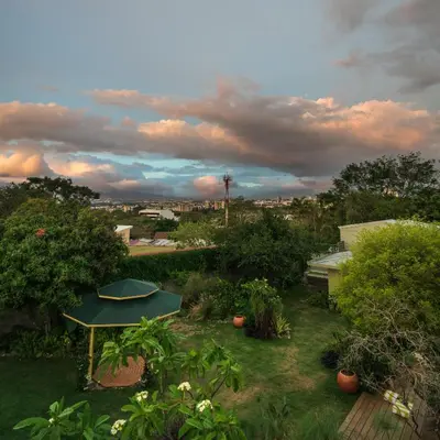 a view of a garden with a picnic table in the grass at Casa 41 in Escazu