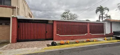 a group of pumpkins sitting in front of a building at Casa Kitus in San José