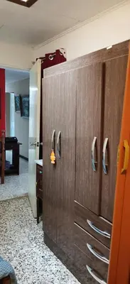 a room with a wooden cabinet with handles at Casa Kitus in San José