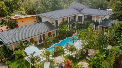 an aerial view of a house with a swimming pool at COCO Beach Village in Matapalo