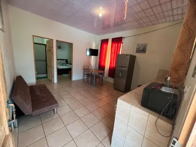 an overhead view of a living room with a couch and a television at Los Sueños RyG 1 in Quepos