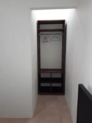 a room with a closet with a glass door at Los Sueños RyG 1 in Quepos