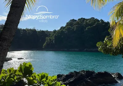 a view of the water from the shore of a beach at Mar y Sombra Villas in Quepos
