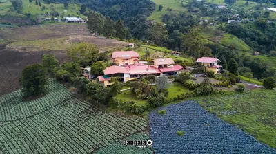 an aerial view of a large house on a hill at Guayabo Lodge in Santa Cruz