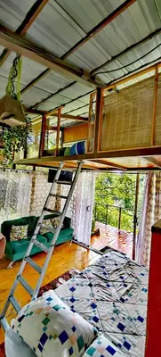 a bedroom with a bunk bed in a house at Cabaña treehouse Mountain View in San Isidro