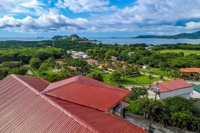 an aerial view of a town with red roofs at Ocean-View 2-BD Condo with Pool in Playa Flamingo