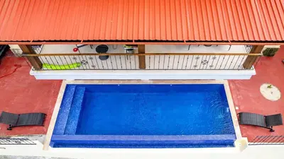 an overhead view of a swimming pool on a house at 2-BD with Ocean-View Terrace and Pool in Playa Flamingo
