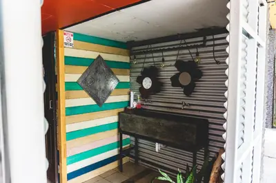 a room with a wall with colorful stripes at Cabinas EL PRADO in San Isidro
