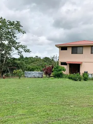 a house with a green field in front of it at Quinta Don Noé in San Mateo