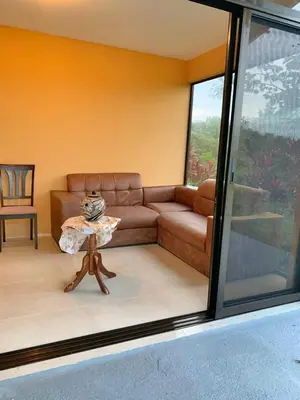 a living room with a couch and a table at Quinta Don Noé in San Mateo