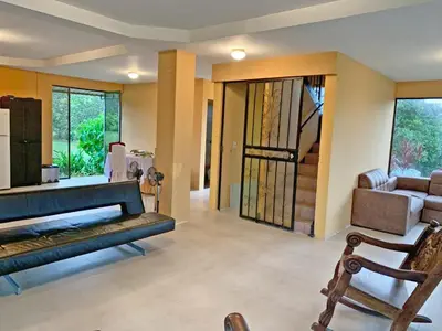 a living room with a couch and a chair at Quinta Don Noé in San Mateo