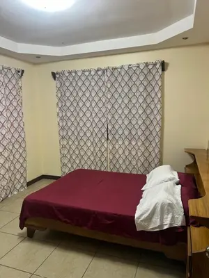 a bedroom with a bed and a window at Quinta Don Noé in San Mateo