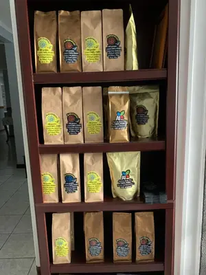 a book shelf filled with bags of food at Stada San Jose Airport Hotel in Alajuela City