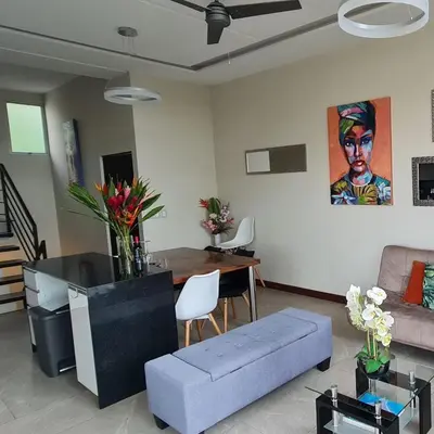 a living room with a couch and a table at Cozy private Apartment, Mirador Escazú -Great view- in Escazu