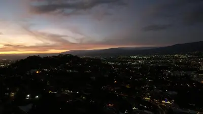 a view of a city at night at Cozy private Apartment, Mirador Escazú -Great view- in Escazu