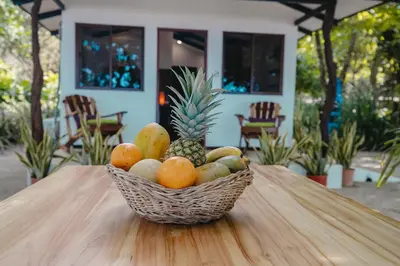 a basket of fruit sitting on top of a table at Villas Paraiso Azul in Santa Teresa Beach