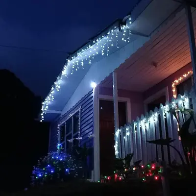 a string of lights on a house at night at Casa Chicua in Sabanilla