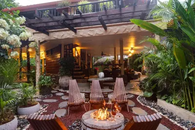 a patio with chairs and a fire pit in front of a house at Casa Melosa in Potrero