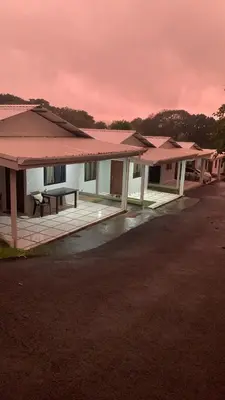 a row of houses with a bench in front of them at Around Juan Santa María in Alajuela City