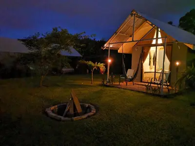 a small tent in a yard at night at Tiny House Dreamcatcher in Sarchí Sur