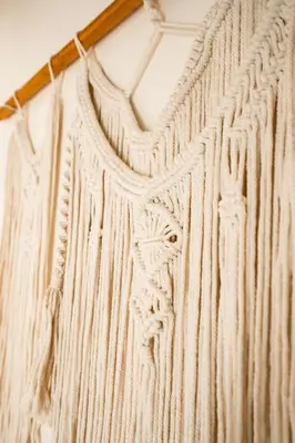 a white sweater hanging on a wall at Tribe Boutique Hotel - Adults Only in Dominical
