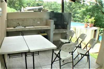 a patio with a table and chairs and a sink at Malaga Herradura 25 with Private Pool in Herradura