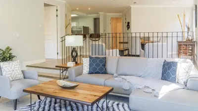 a living room with a couch and a table at Bright 2BR Condo with Partial Ocean View - Bougainvillea - Reserva Conchal in Playa Conchal