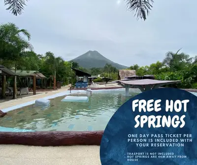 a sign in front of a swimming pool at a resort at Green Leaf House in Fortuna