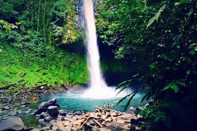 a waterfall in the middle of a river at Green Leaf House in Fortuna