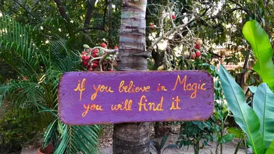 a sign that says if you believe in magic you will find it at Hotel Aurora in Montezuma