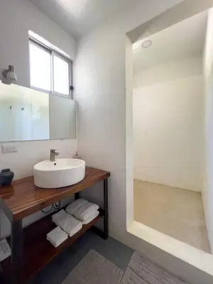 a bathroom with a sink and a mirror at Salt Nosara in Nosara