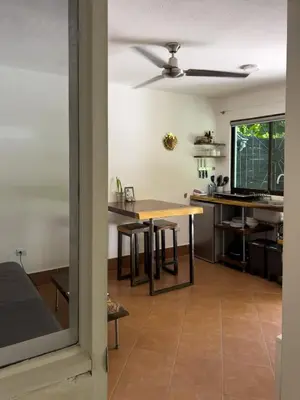 a kitchen and dining room with a table at Salt Nosara in Nosara
