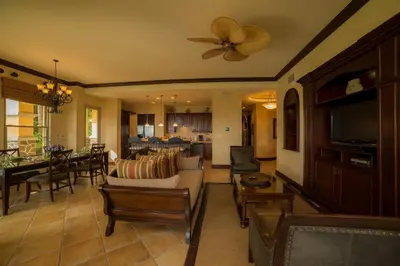 a living room with a couch and a dining room at Marbella 1E 3 bdr Ocean View in Los Suenos in Herradura