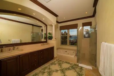 a large bathroom with a shower and a tub at Marbella 1E 3 bdr Ocean View in Los Suenos in Herradura