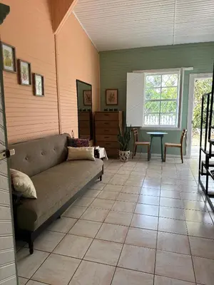 a living room with a couch and a table at CASA STELLA in Heredia