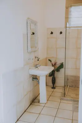 a bathroom with a sink and a shower at CASA STELLA in Heredia