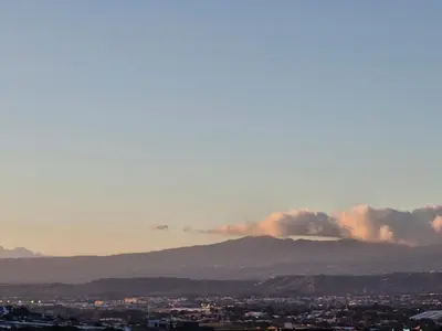 a view of smoke billowing over a city with mountains at Sheraton San Jose Hotel, Costa Rica in San José