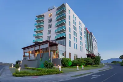 a hotel with a building on the side of a street at Sheraton San Jose Hotel, Costa Rica in San José
